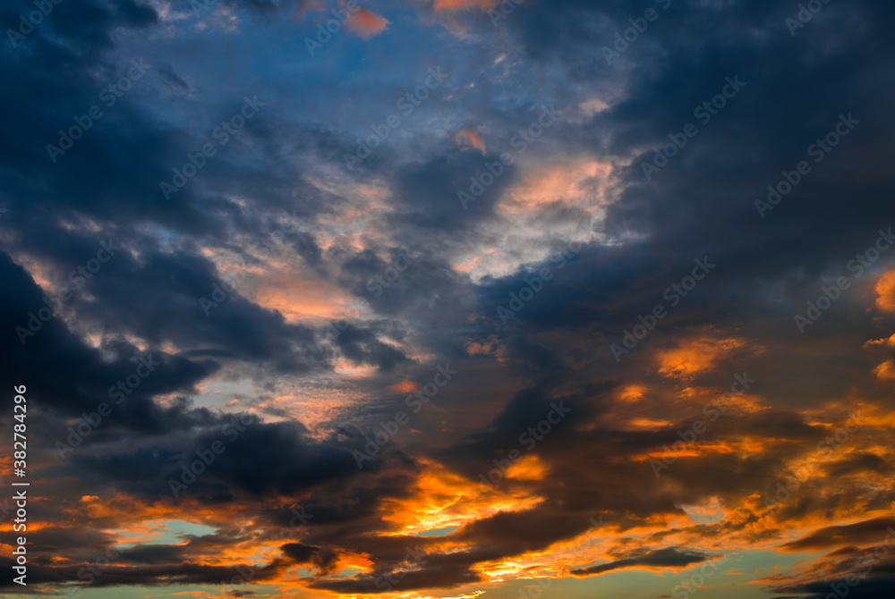 Beautiful sunset. Yellow and black clouds in the sky Beautiful sunset. Yellow and black clouds in the sky