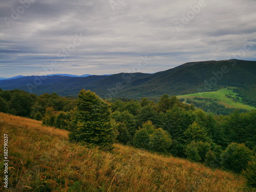 Bieszczady Poland. Carpathians European Mountains. Mountain trails in the Bieszczady Mountains. Autumn colors of the mountains. Cloudy sky.Mountains in autumn.