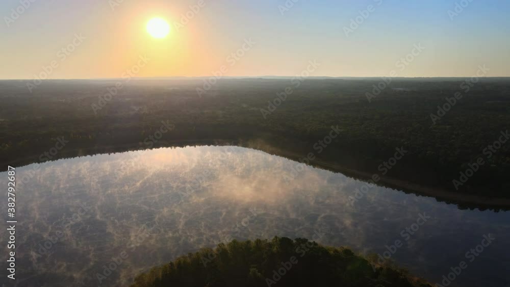 Morning mist sunrise the fog in the autumn over the lake with the water Morning mist sunrise the fog in the autumn over the lake with the water