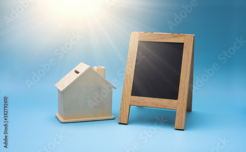 Small blackboard with house model, Loan for business investment sell the real estate or buy home concept.
