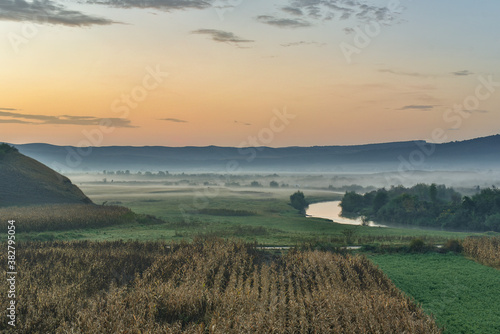 The river and the fog at sunrise.