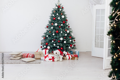 Christmas tree blue pine with gifts interior decor white room new year winter holiday