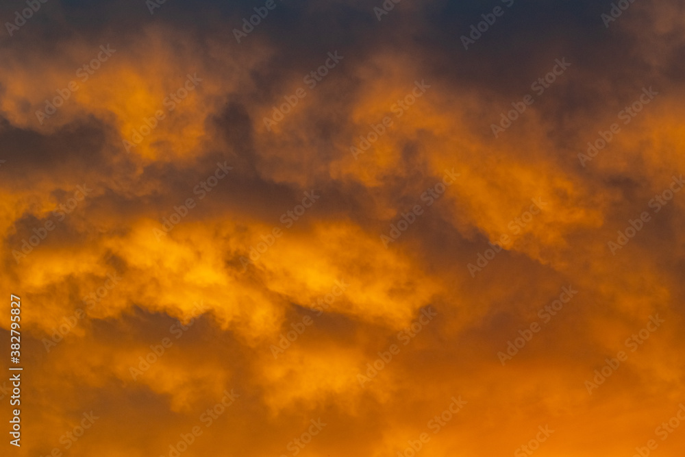 a close up of gold clouds on the horizon during a sunset over the Mediterranean