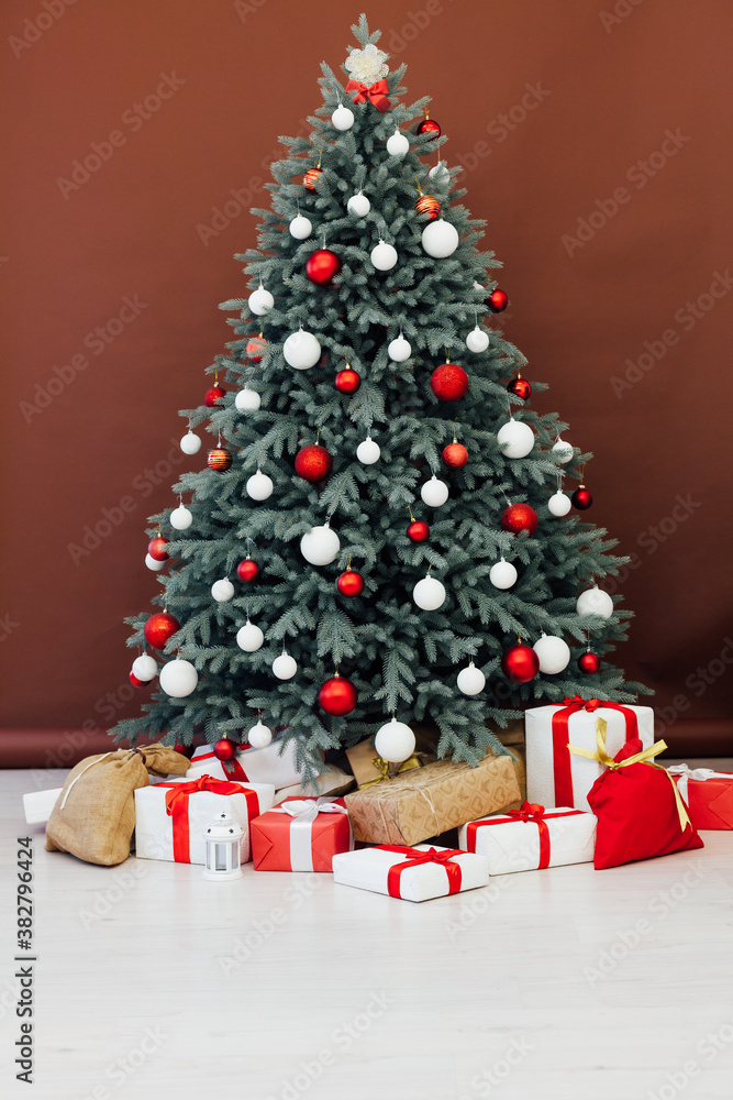 Christmas tree blue pine with gifts interior decor red background New Year winter holiday