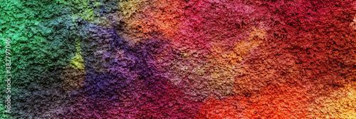Colorful painted plastered concrete wall. Abstract colorful texture background