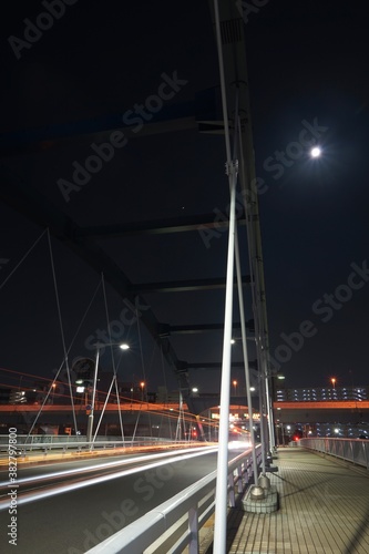 水神大橋の夜景と満月 レーザービーム 
