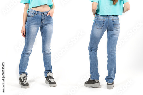 girl in jeans shows off jeans on white background close up, blue jeans