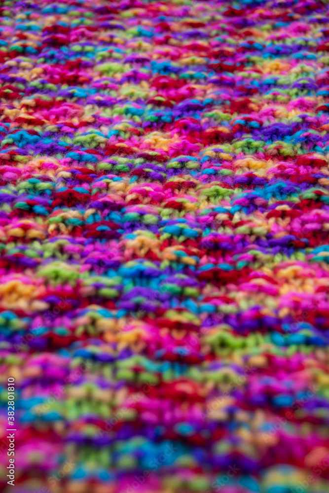 The structure of a colorful knitted scarf