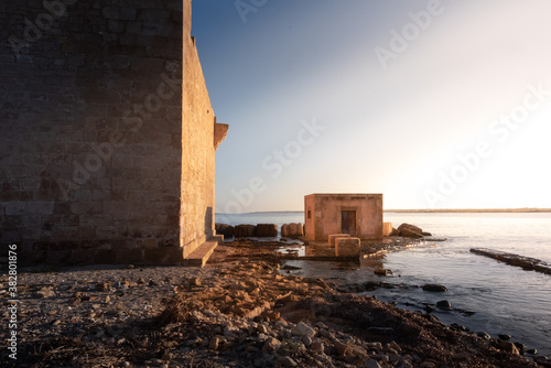 Shot of the ruins of the ancient building Tonnara di Vendicari. The building was used in the past as a workplace for tuna fishing. The place is now abandoned and it is a naturale reservation place
