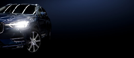 Black modern car on black background.