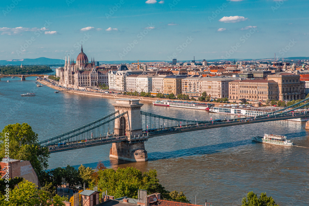 Fototapeta premium The panorama view of the skyline in Budapest, Hungary, with Széchenyi Lánchíd over the Danube, and the parliament building in Hungary.