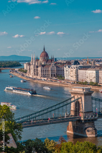 The panorama view of the skyline in Budapest, Hungary, with Széchenyi Lánchíd over the Danube, and  the parliament building in Hungary.
