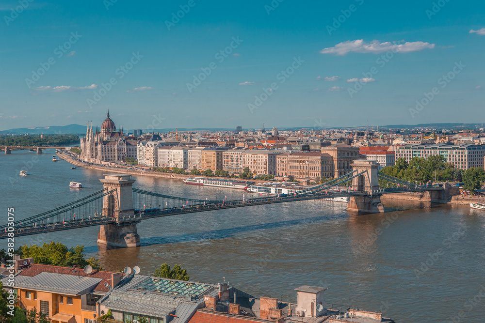 Obraz premium The panorama view of the skyline in Budapest, Hungary, with Széchenyi Lánchíd over the Danube, and the parliament building in Hungary.