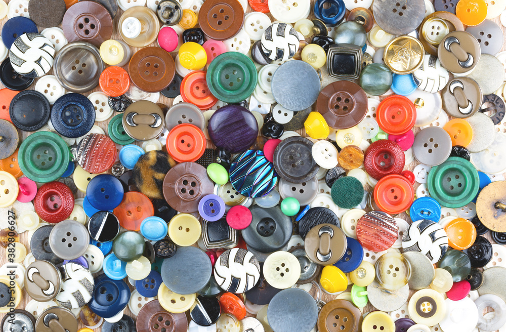 Many buttons of different colors and different shapes as background, texture, pattern. Many buttons of different colors and different shapes as background, texture, pattern.