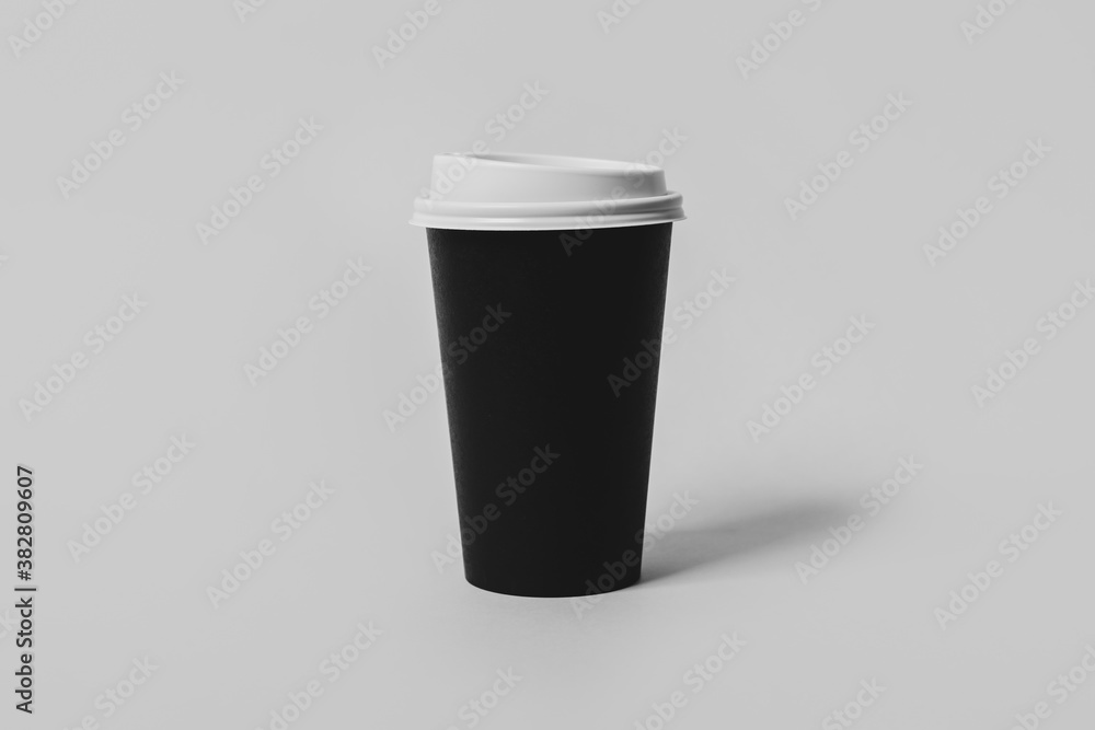 Takeaway paper coffee cup on light grey background Takeaway paper coffee cup on light grey background