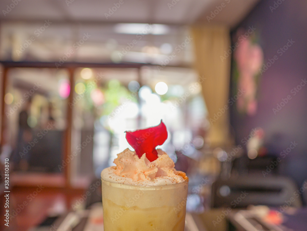 Close up Ice Coffee topping with whip cream and Rose leaf in Coffee cafe Close up Ice Coffee topping with whip cream and Rose leaf in Coffee cafe