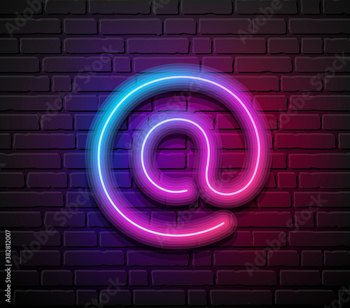 At sign neon iight colorful design, on block wall black background, Eps 10 vector illustration photo