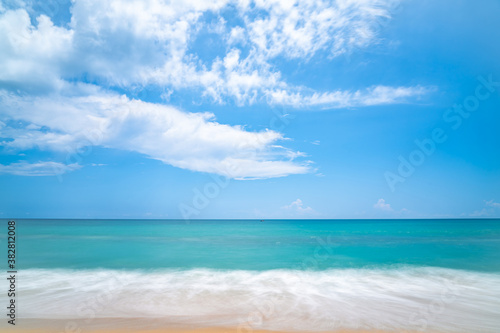 Seascape of soft wave in tropical sea and sandy beach blue cloud sky.