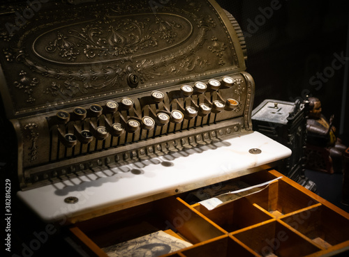 Old-time cash register with money