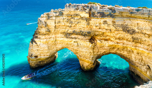 Landscape with natural arch, near Praia da Marinha, one of the most famous place of Portugal, located on the Atlantic coast in Lagoa, Algarve.