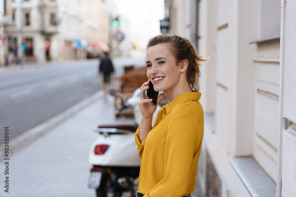 Young woman listening to a call on her mobile