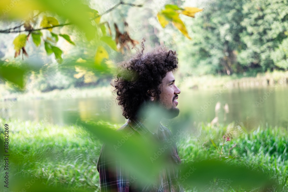 Fotografie A man at a river, peaceful calm environment