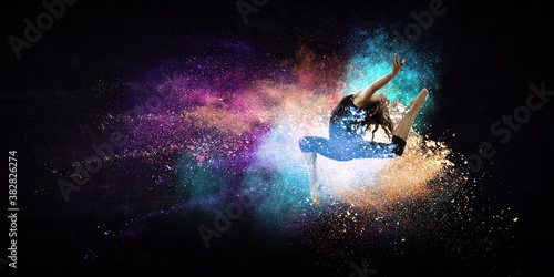 Female dancer against colourful background © Sergey Nivens