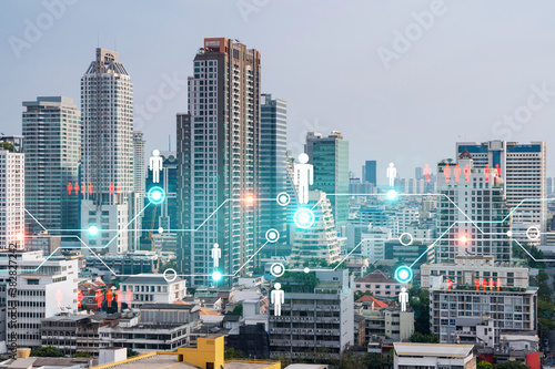 Social media icons hologram over panorama city view of Bangkok, Asia. The concept of people networking and connections. Double exposure.