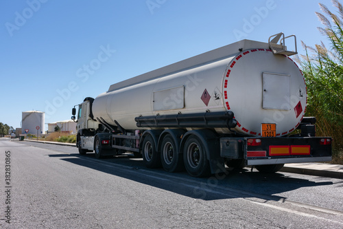 Fuel tanker next to the storage tanks where the product to be transported is loaded.