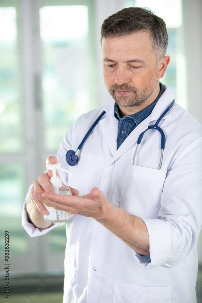 selective focus on the doctor cleaning his hands selective focus on the doctor cleaning his hands