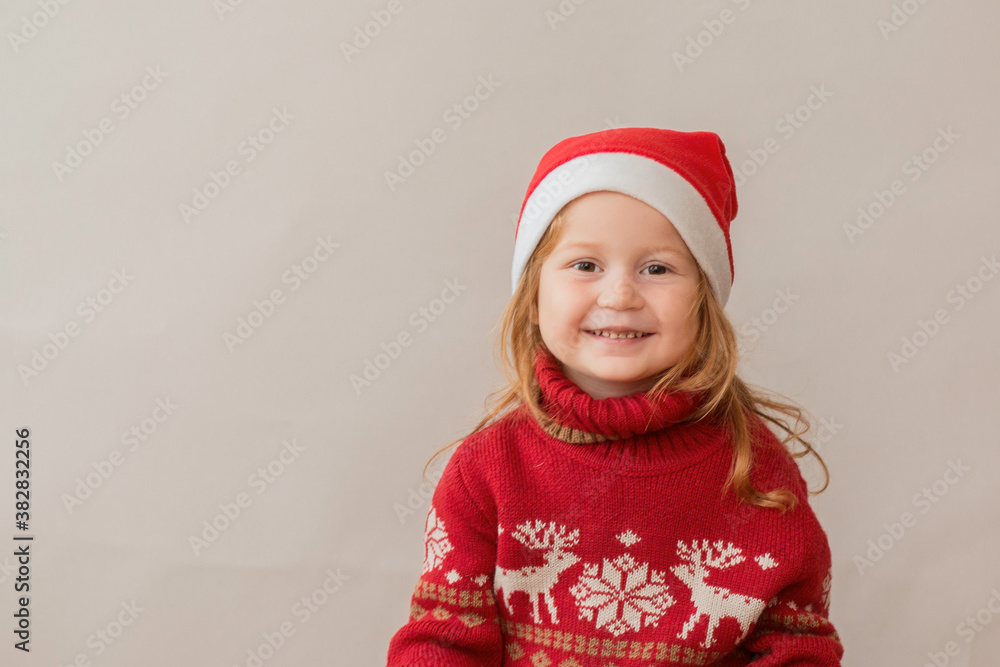 Happy Redhair girl in christmas jacket and santa hat Happy Redhair girl in christmas jacket and santa hat