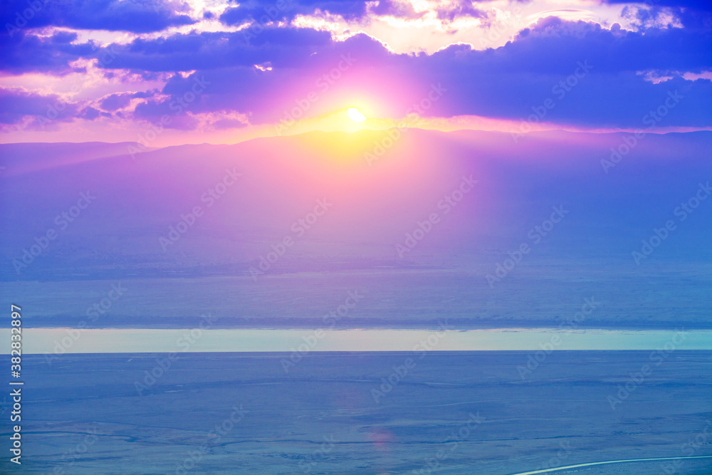 Beautiful purple sunrise over the Dead Sea. View from Masada fortress in Judaean Desert