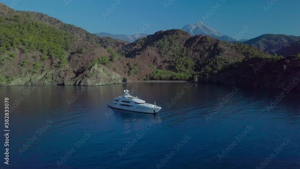 Aerial view of a luxury yacht and beautiful sea bay Aerial view of a luxury yacht and beautiful sea bay