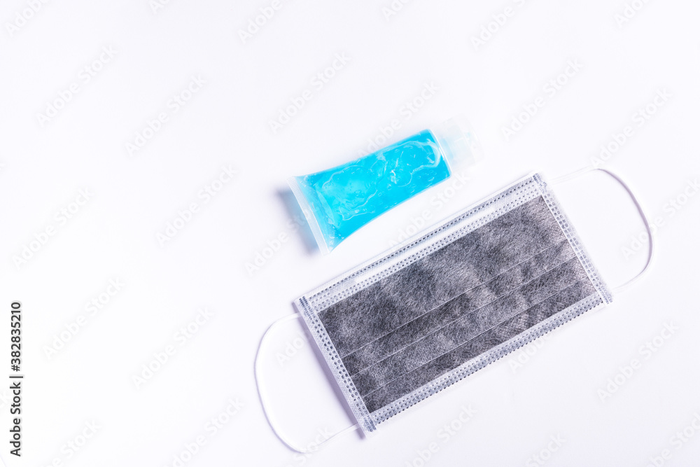 Medical carbon protective face mask for cover mouth and nose and alcohol gel sanitizer hand gel cleaners isolated on white background, Safety healthcare medical prevent coronavirus or Covid-19 Medical carbon protective face mask for cover mouth and nose and alcohol gel sanitizer hand gel cleaners isolated on white background, Safety healthcare medical prevent coronavirus or Covid-19