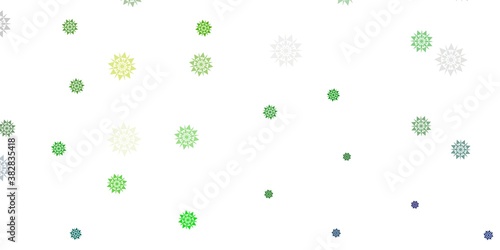 Light blue, green vector pattern with colored snowflakes.