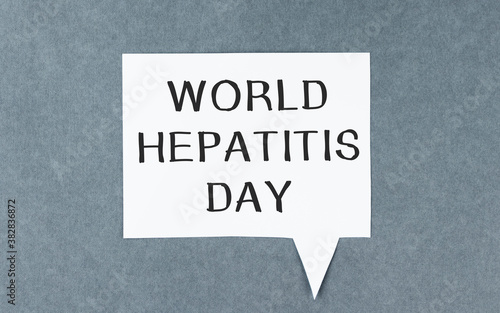 text World Hepatitis Day. June 28. White paper with text on a gray background.