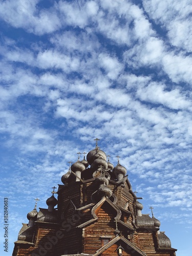 Wallpaper Mural Wooden orthodox church domes in the blue sky with clouds Torontodigital.ca