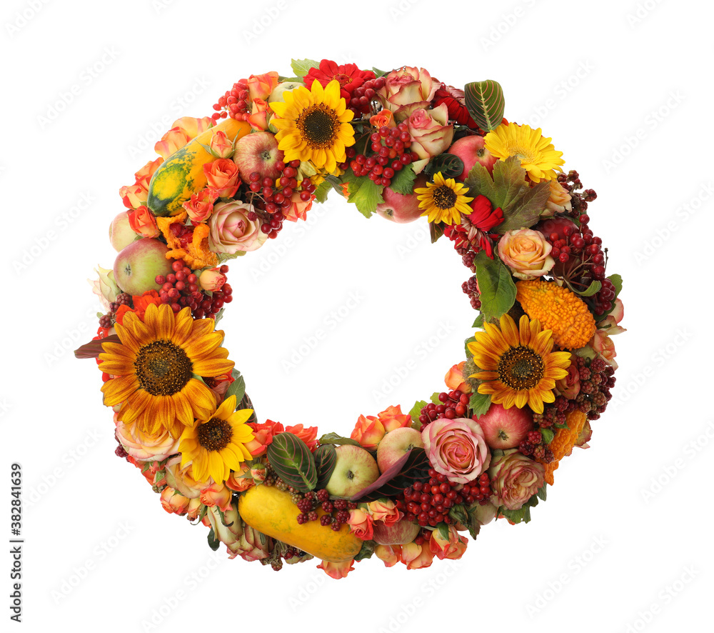 Beautiful autumnal wreath with flowers, berries and fruits isolated on white