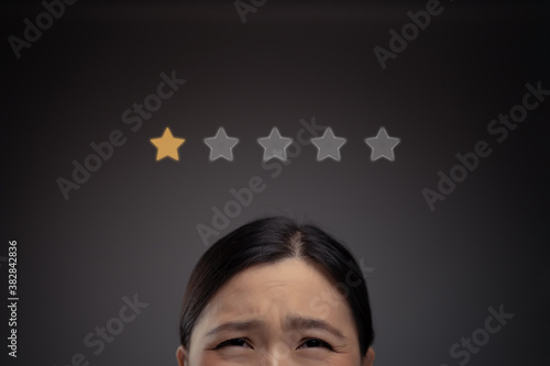 Sad Asian woman and star icon hologram effect.