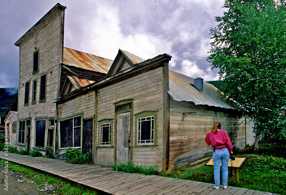 Visitor to old gold rush era (late 1890’s) buildings with Western false
