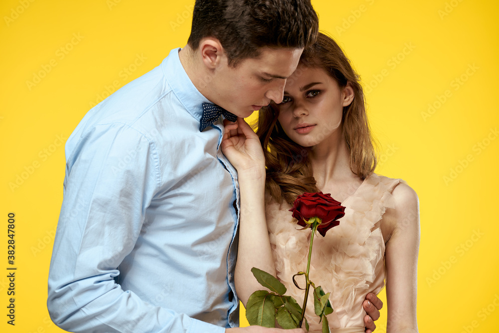 romantic couple in love with red flower hugging each other cropped view Copy Space romantic couple in love with red flower hugging each other cropped view Copy Space
