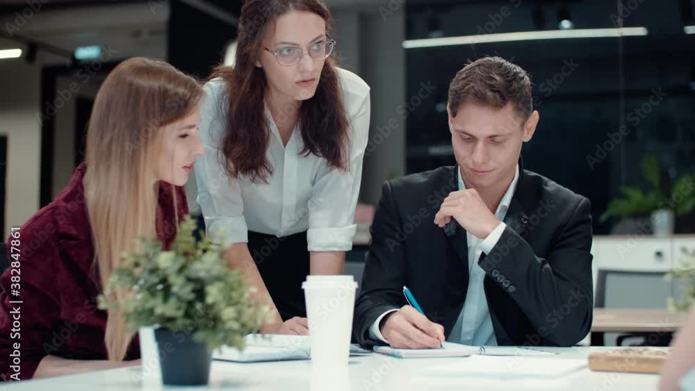 Diverse business team brainstorm talk engaged in teamwork at corporate briefing Diverse business team brainstorm talk engaged in teamwork at corporate briefing