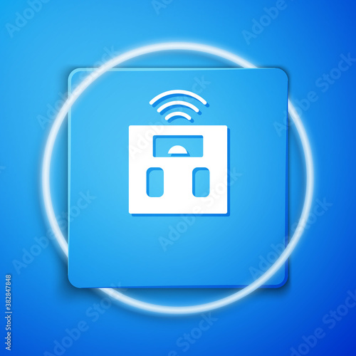 White Smart bathroom scales icon isolated on blue background. Weight measure equipment. Internet of things concept with wireless connection. Blue square button. Vector.