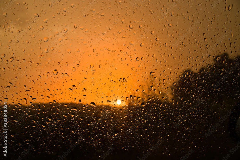 Transparent glass at sunset in raindrops
