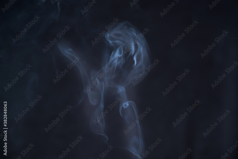 Smoke in motion on dark background	