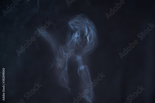 Smoke in motion on dark background 