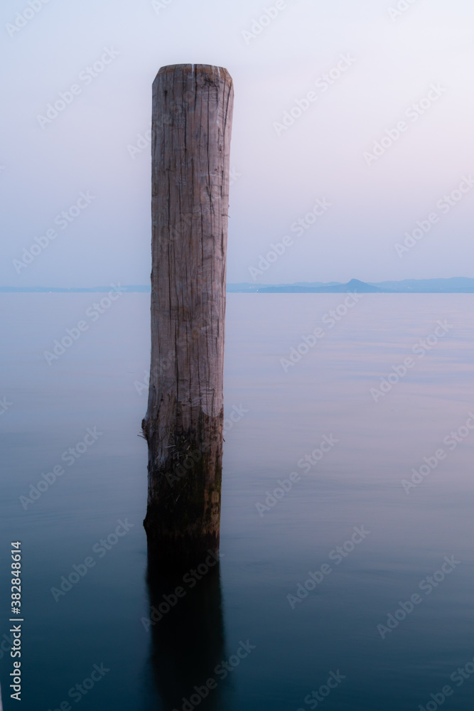 Pier pole in sunrise