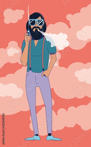 A young hipster man in sunglasses smokes a vaping device against a background of puffs of smoke.
