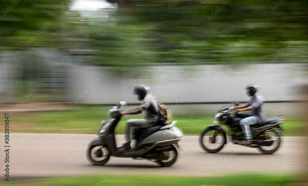 Fototapeta premium persons riding in bikes, blurred background