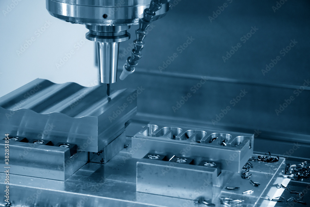 The CNC milling machine cutting the mold parts by solid ball end-mill tool. The hi-precision mold and die manufacturing concept by machining center. The CNC milling machine cutting the mold parts by solid ball end-mill tool. The hi-precision mold and die manufacturing concept by machining center.